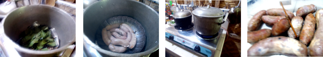 Imagws of sausages being smoked in a pan in a tropical
        kitchen