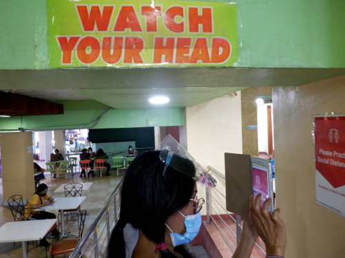 Image of woman watching her head