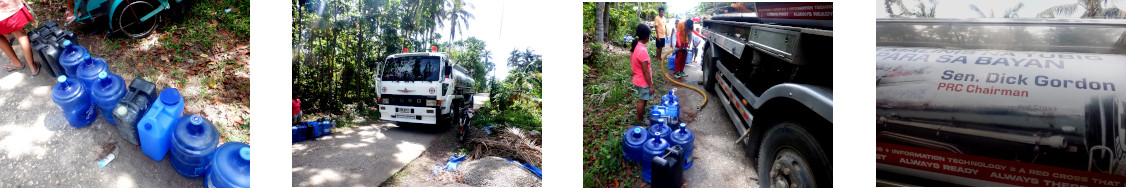 Images of Red Cross delivering water in january as relief
        from typhoon Rai in December