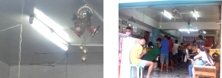 Imagews of a barber's shop in
        Tagbilaran with electricity -three weeks after typhoon Raityhree
        weeks